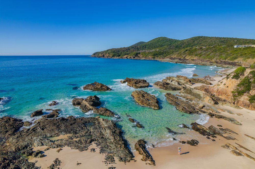 An Aerial View of A Beach with Rocks and A Body of Water — L.L Projects in Forster, NSW