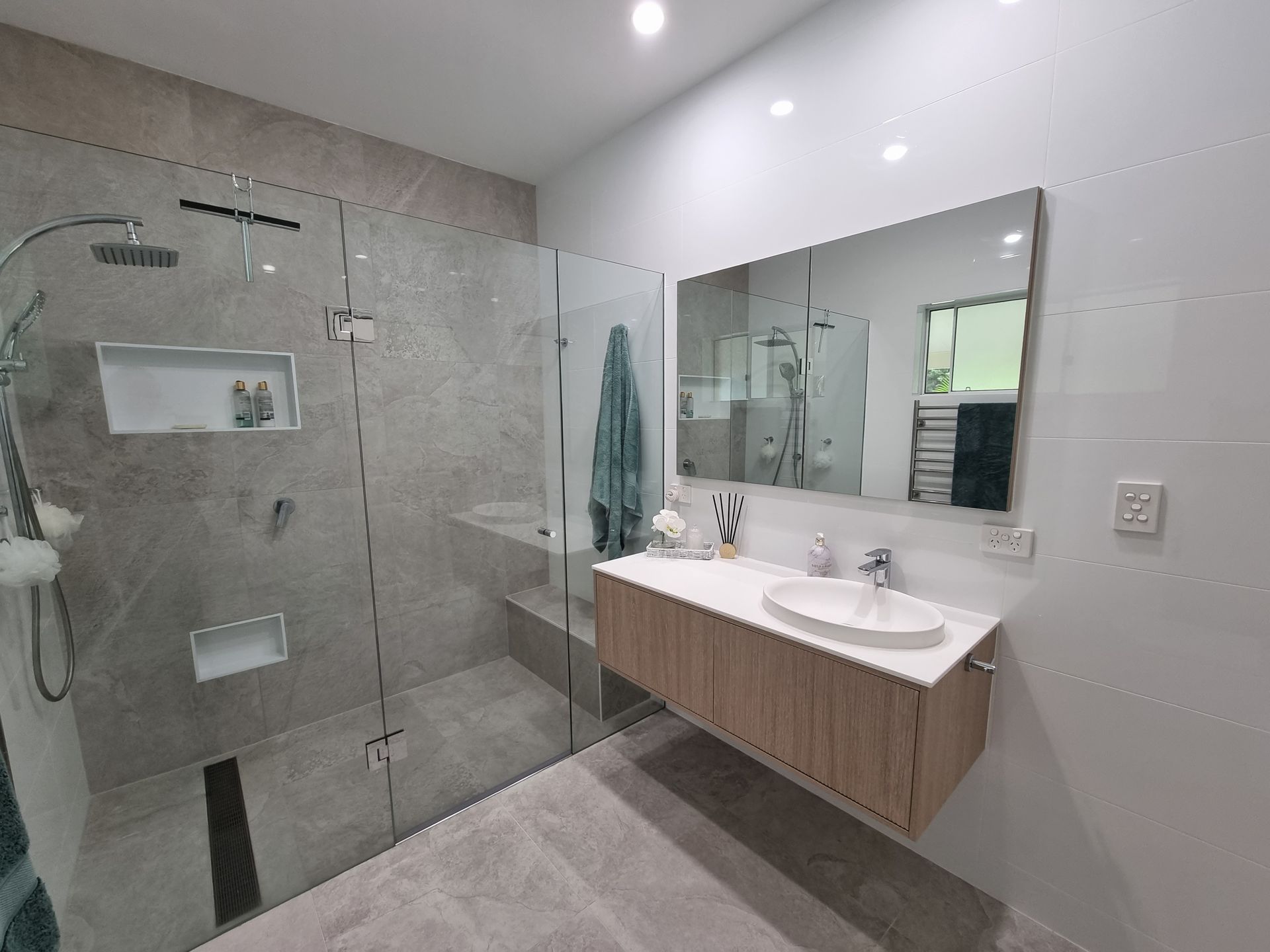A Bathroom with A Walk in Shower, Sink and Mirror — L.L Projects in Hallidays Point, NSW