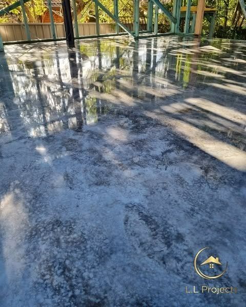 A Concrete Floor with A Reflection of Trees in It — L.L Projects in Gloucester, NSW