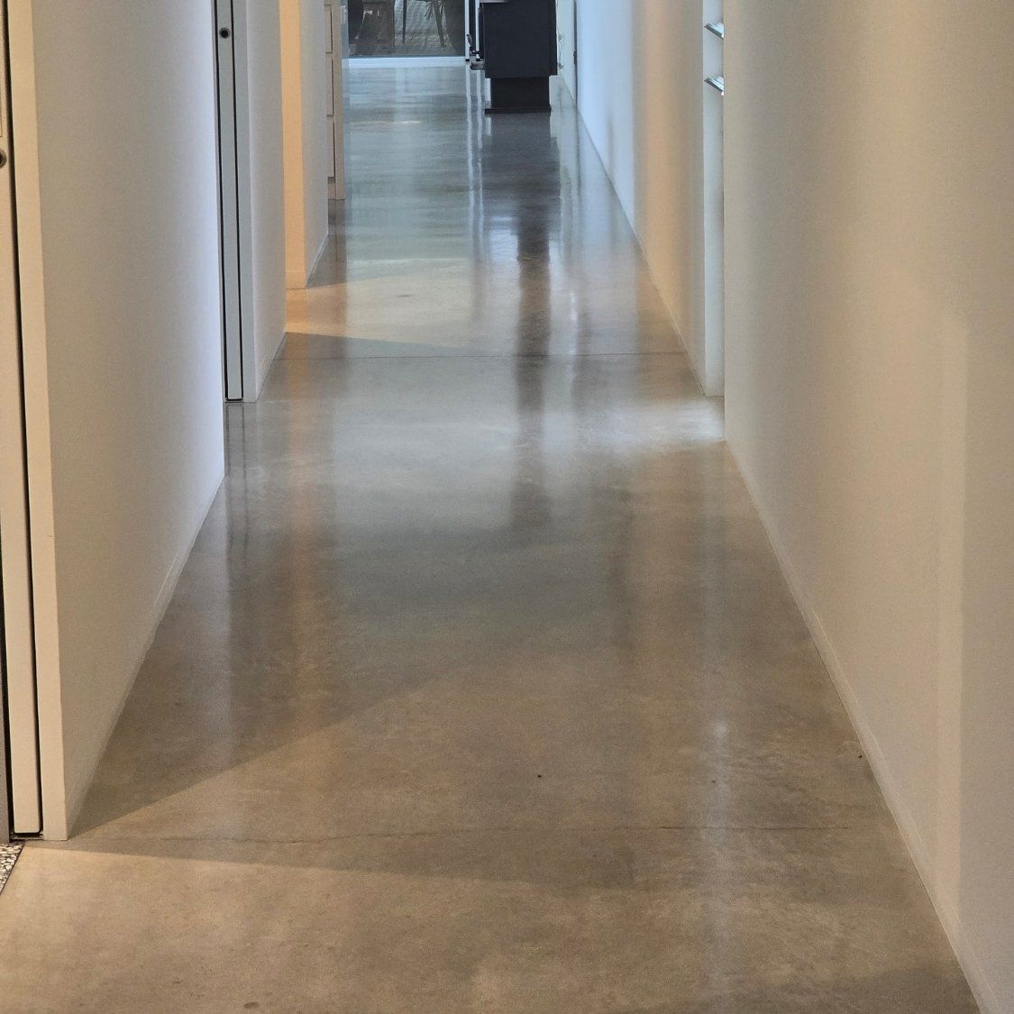 A Long Hallway with A Shiny Floor and White Walls — L.L Projects in Smiths Lake, NSW