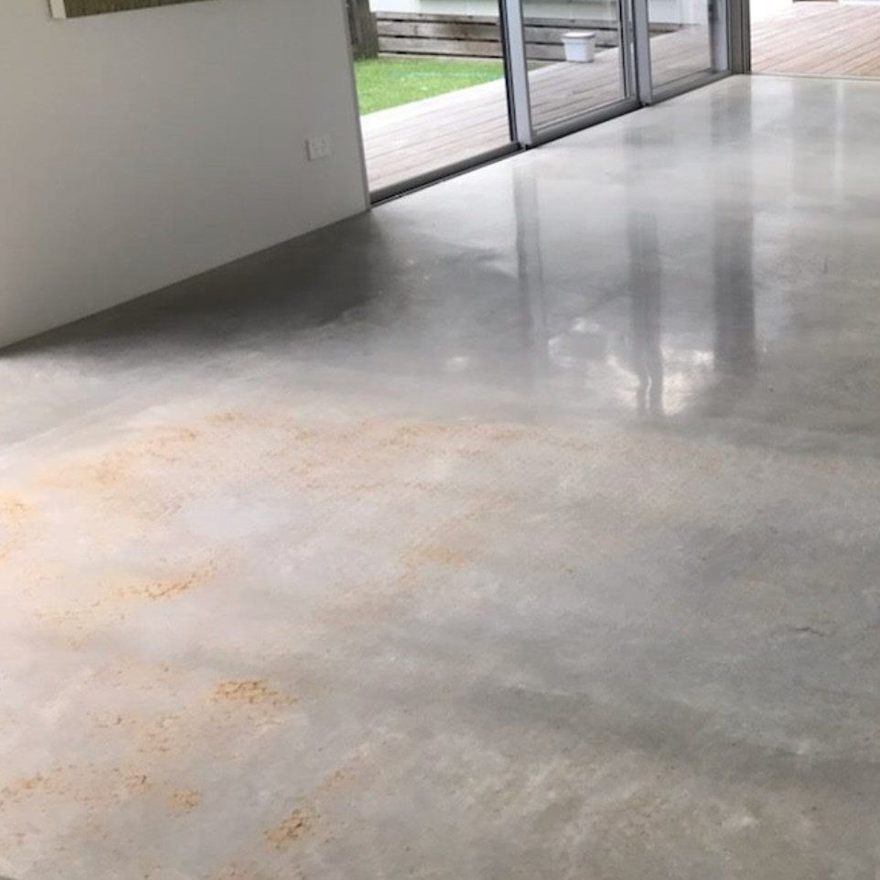 A Concrete Floor in A Room with Sliding Glass Doors — L.L Projects in Taree, NSW