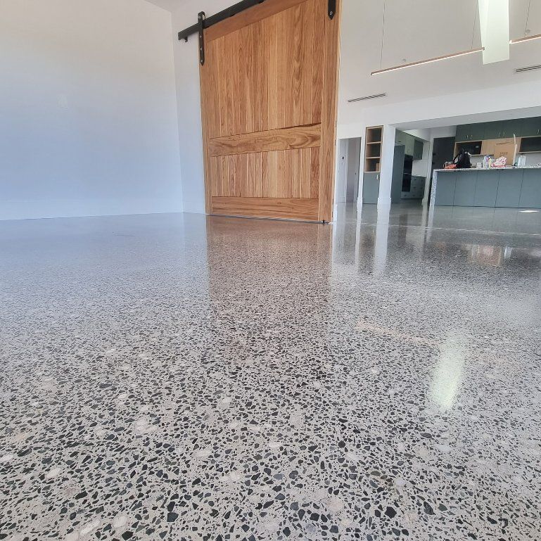 A Room with A Sliding Barn Door and A Shiny Floor — L.L Projects in Taree, NSW