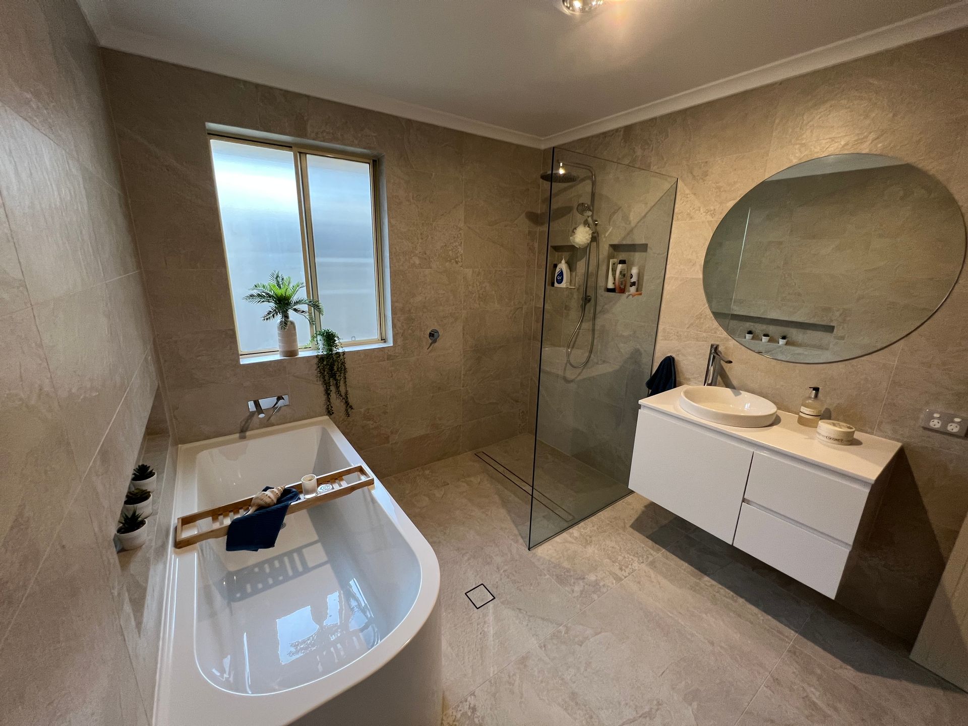 A Bathroom With a Glass Shower — L.L Projects in Forster, NSW