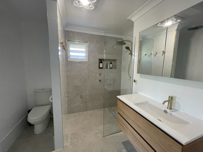 Modern Bathroom With a Shower Area Including a Wall Mirror Beside  — L.L Projects in Gloucester, NSW