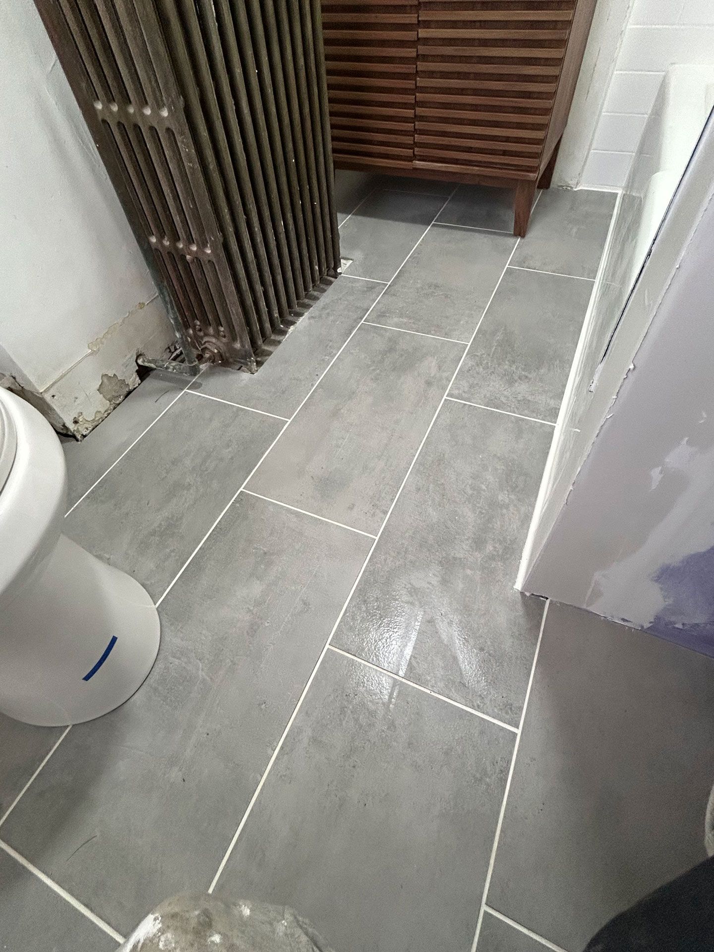 Bathroom gray tiles flooring — Pittsburgh, PA — Ahrn City Contracting LLC