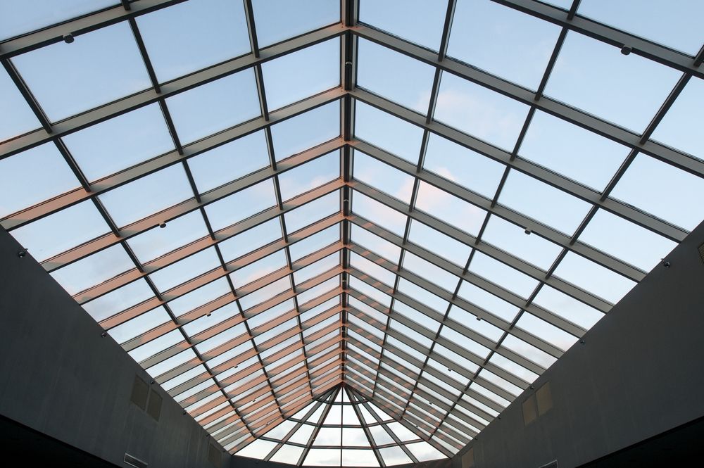 Skylight With Grid of Glass Panes, Blue Sky Visible Above — CP Roofing in Old Bar, NSW