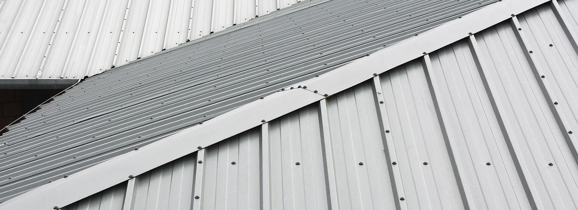 A Close Up Of A White Metal Roof On A Building — CP Roofing in Gloucester, NSW