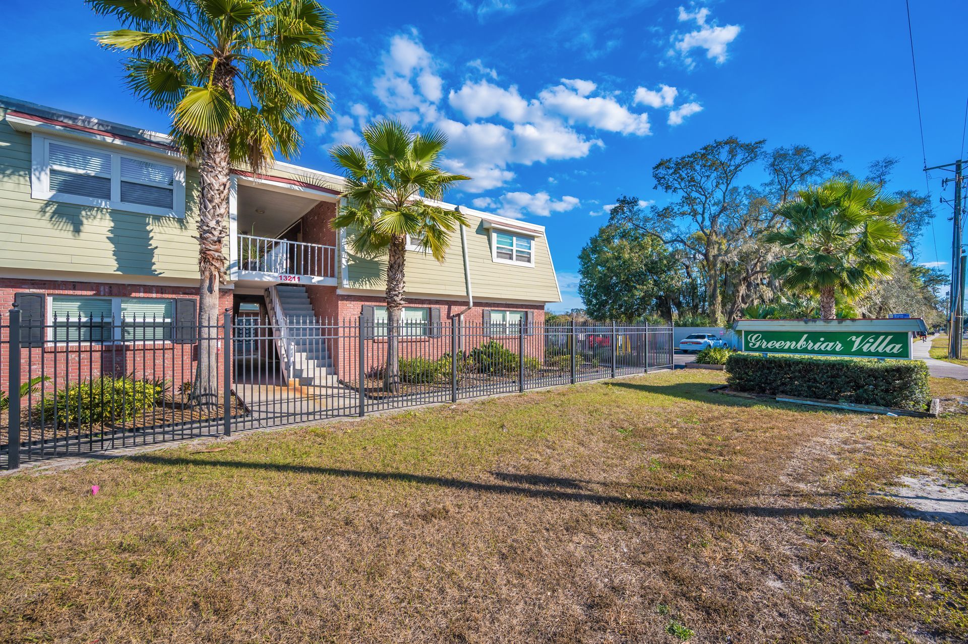 Apartment building with a sign that reads 