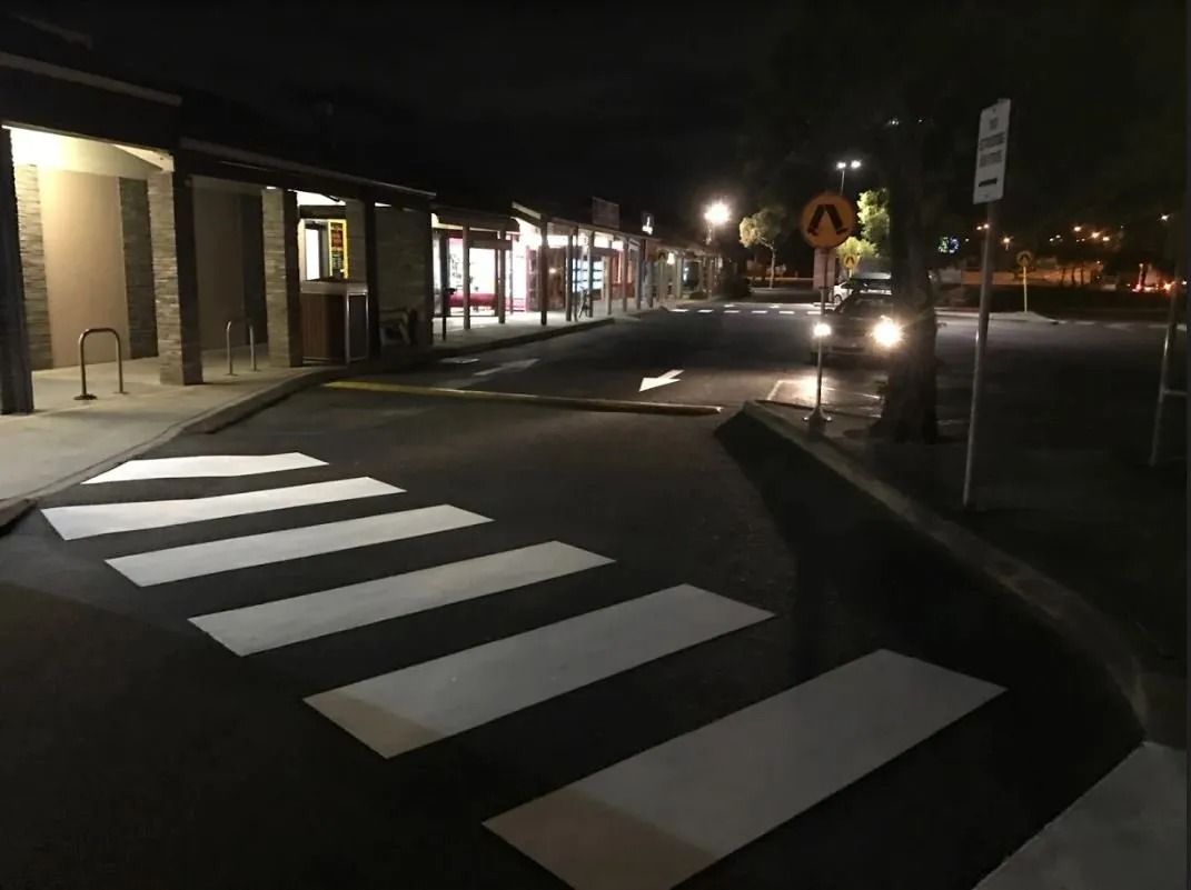 Nighttime street with crosswalk