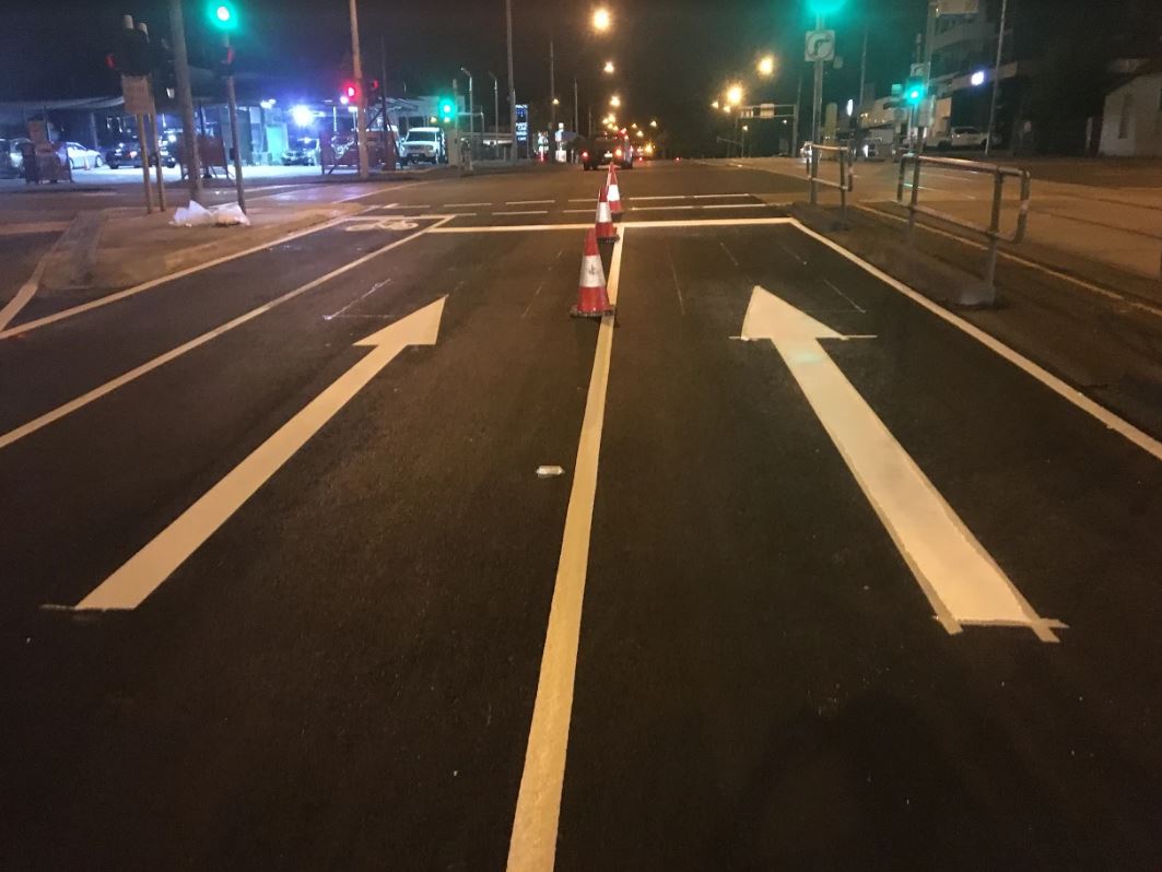 White color arrow markingon road