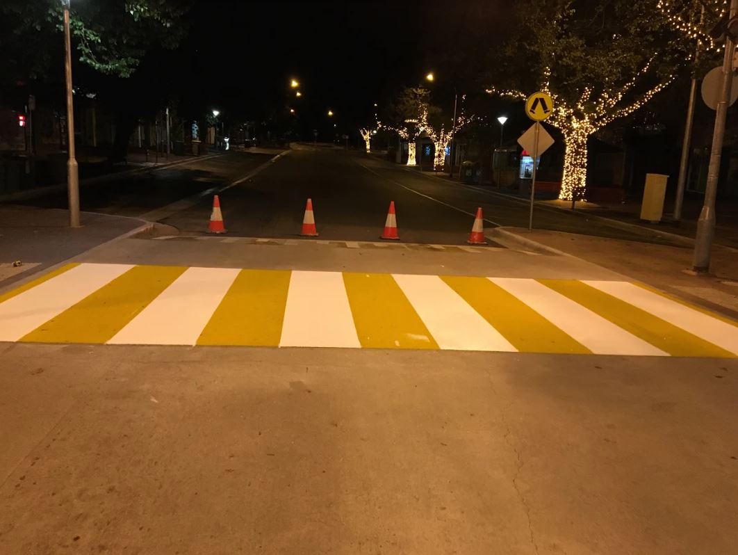 white & yellow line marking on road