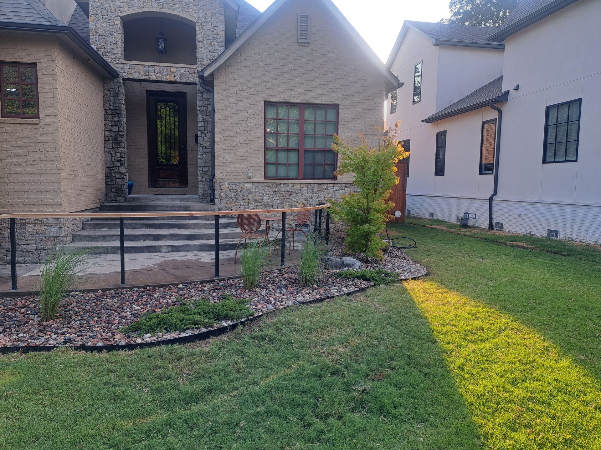 A house with a large lawn in front of it