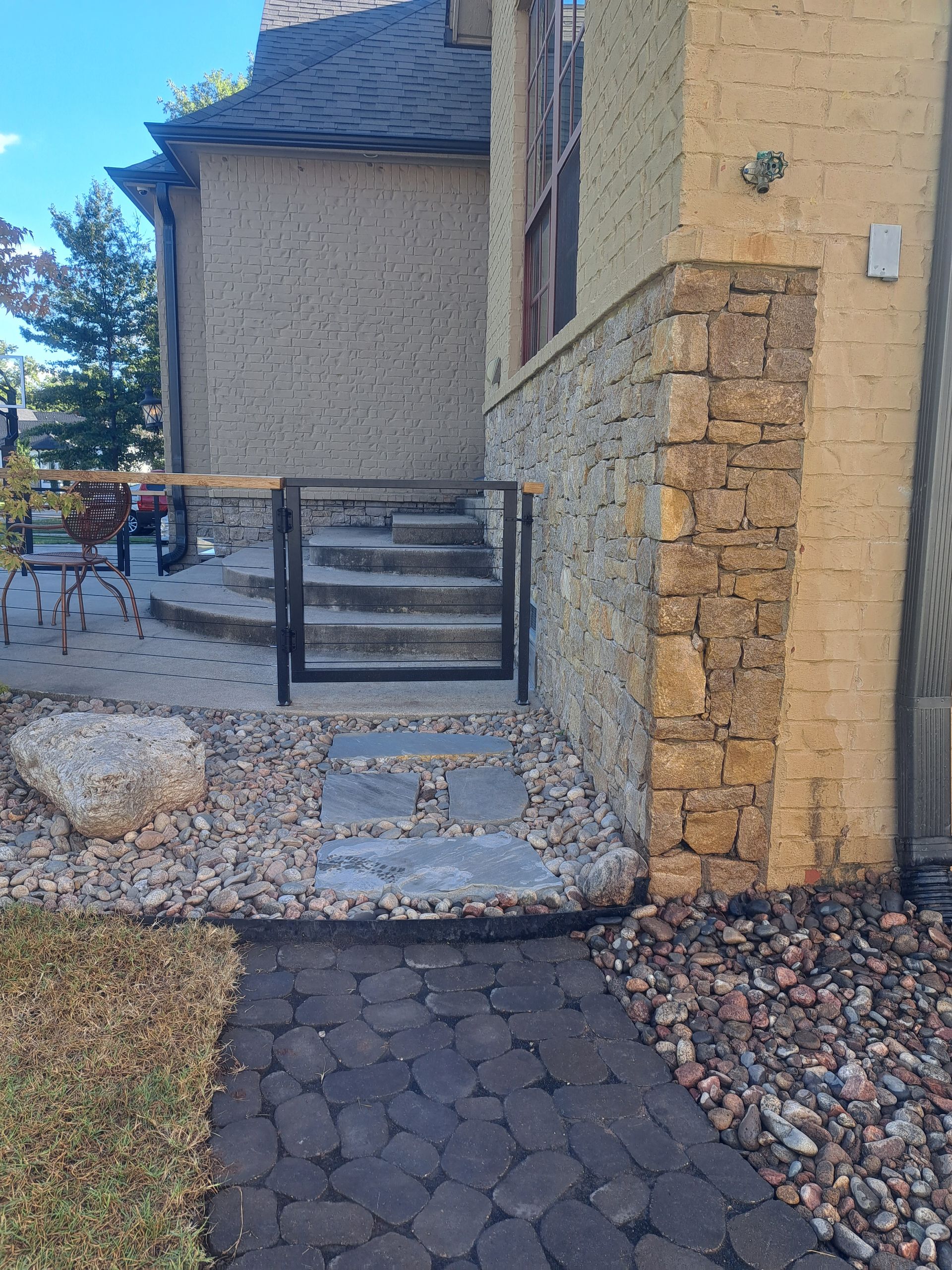 A stone building with stairs leading up to it