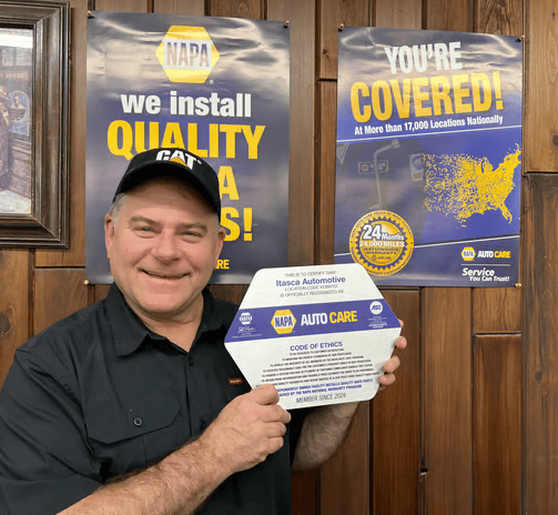 Outside of shop with Now Open sign | Itasca Automotive