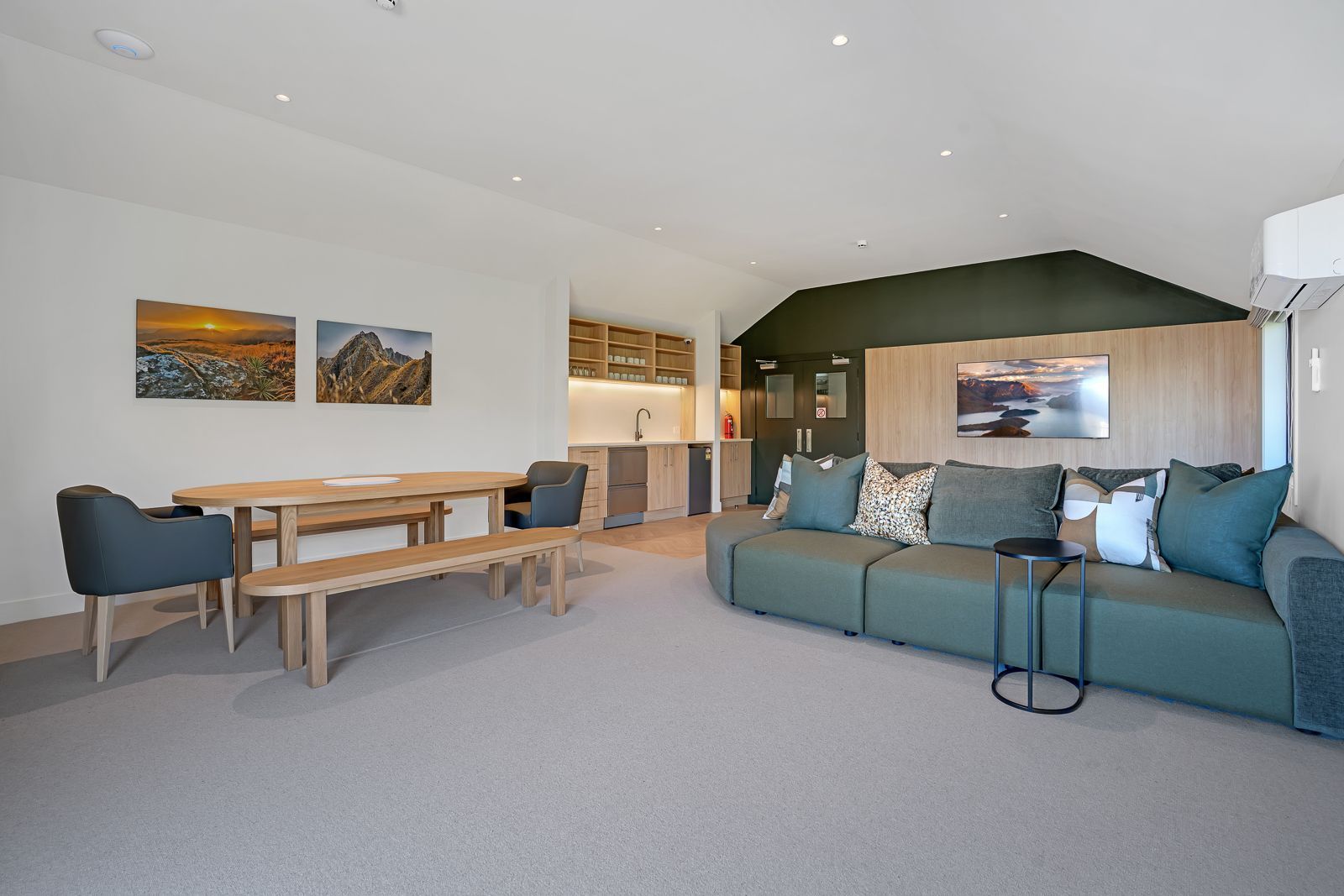 A large lobby with a lot of furniture and a large window.