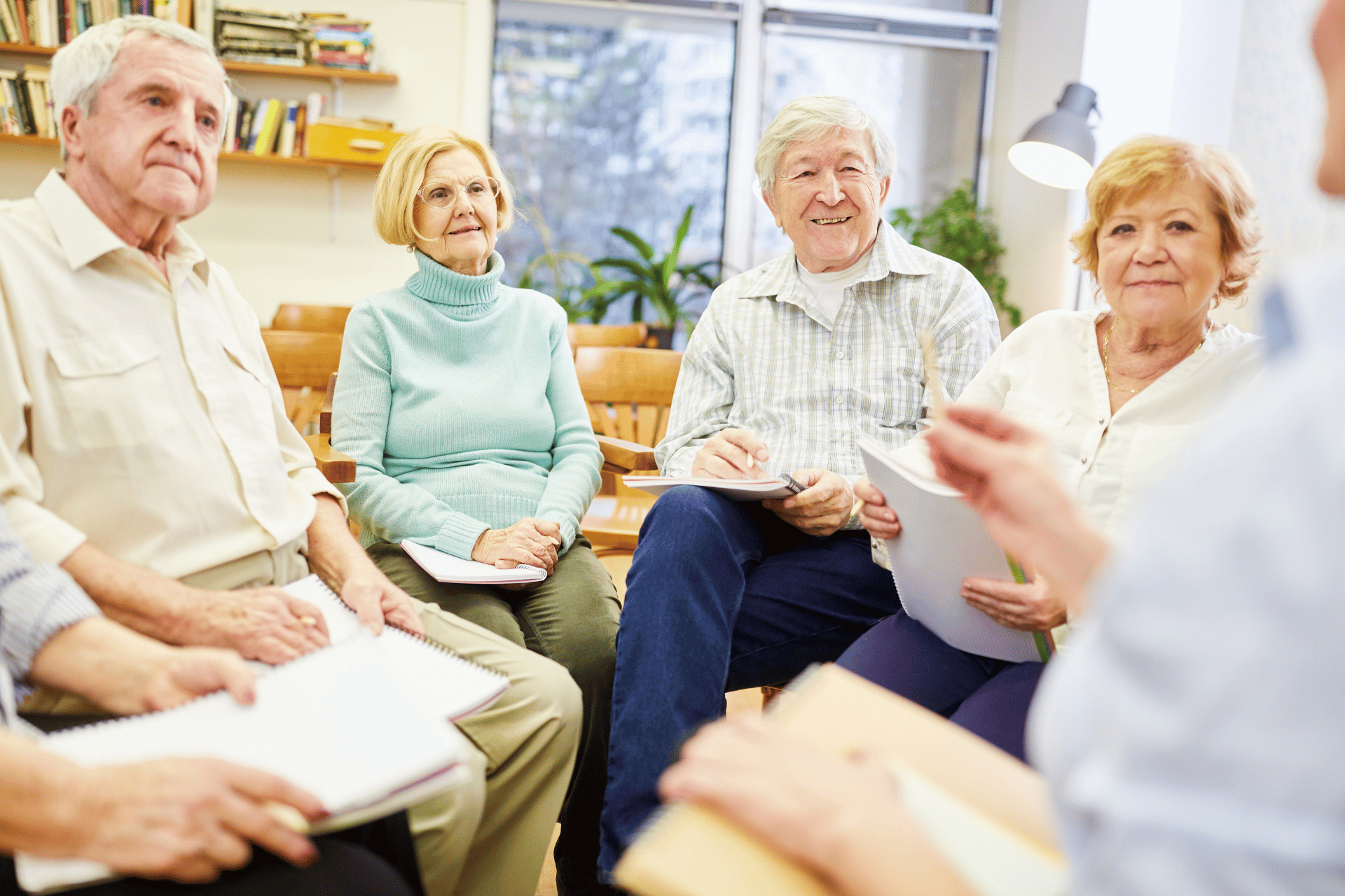 Group of seniors reviewing Medicare information during an educational meeting in Lincoln, Nebraska