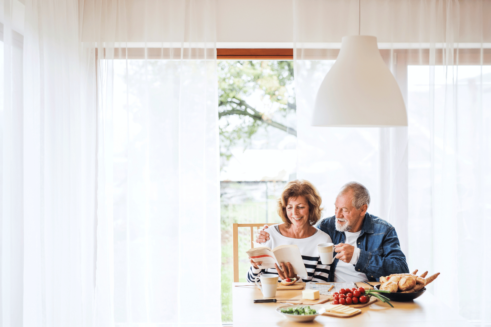 Senior couple in Nebraska reviewing Medicare Supplement plan paperwork at home