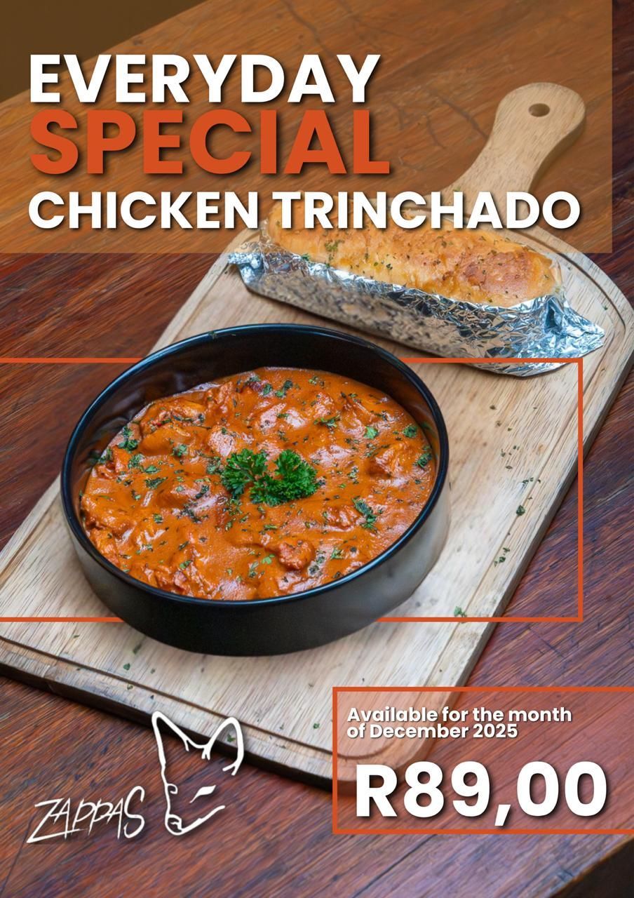 Everyday special at Zappas in Murrayfield, Pretoria: Chicken trinchado in a black dish, bread roll, wooden board. R89.00