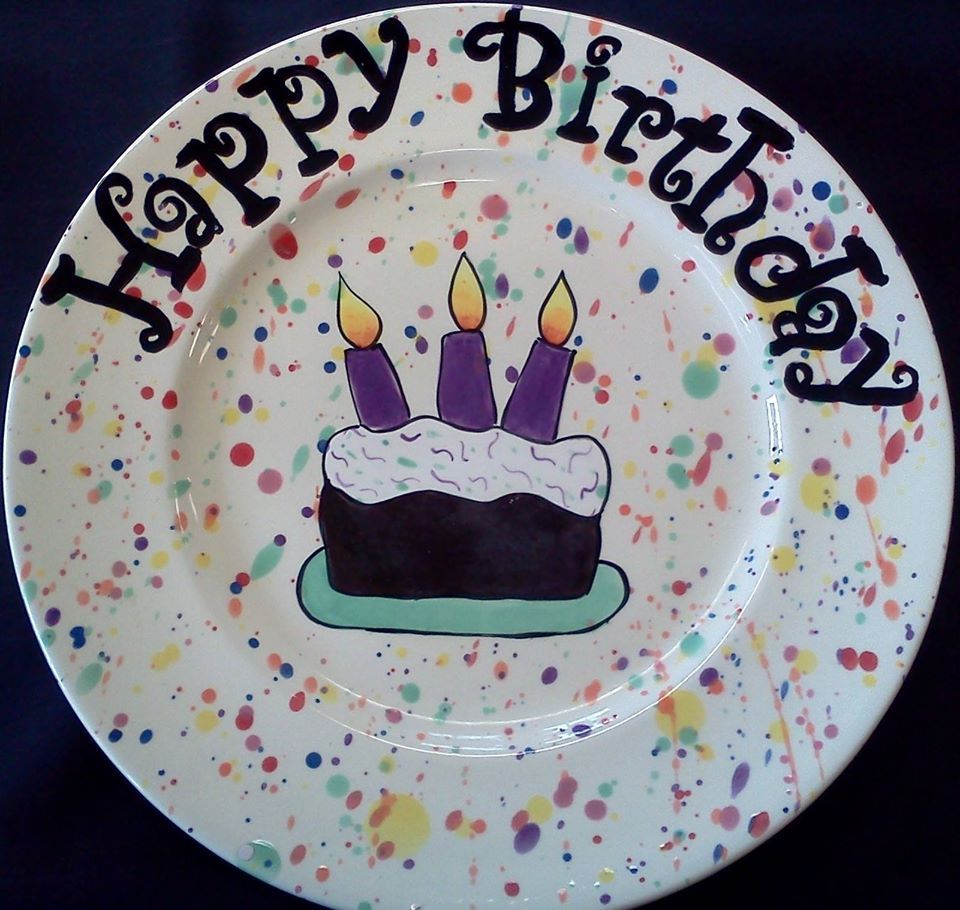 A plate that says happy birthday with a cake on it