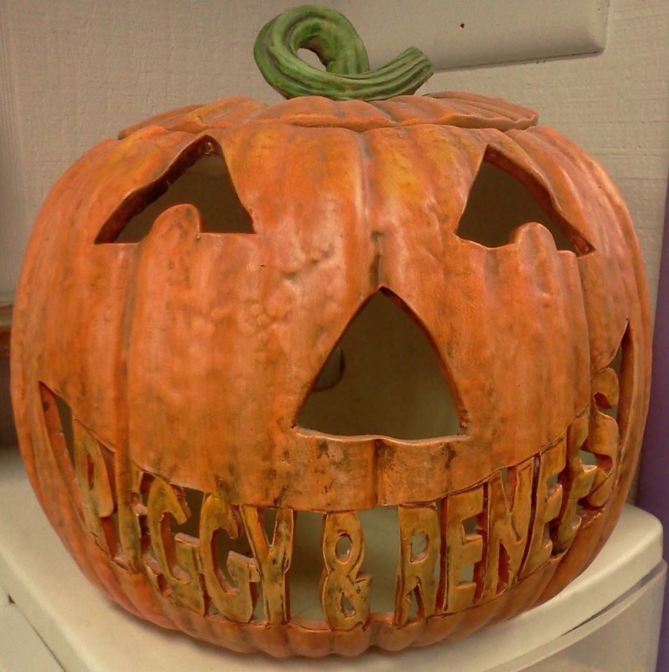 A pumpkin with the name peggy and renee carved into it