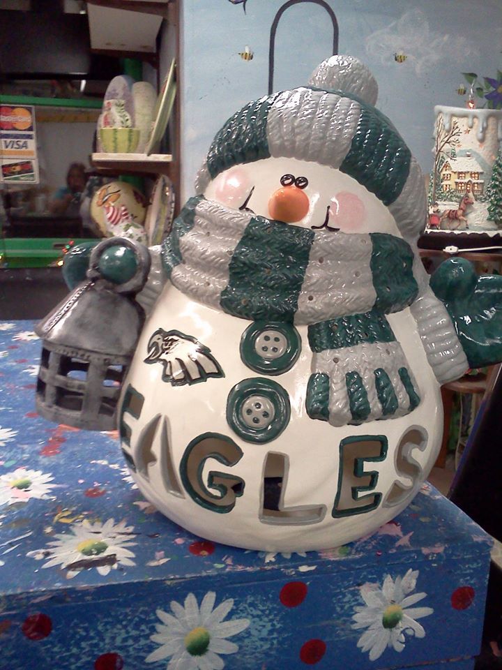 A snowman with the word eagles on it