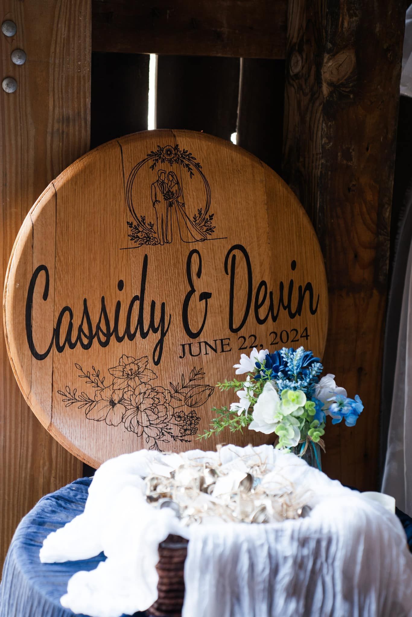 Three wooden signs with latitude and longitude written on them are sitting on a table.