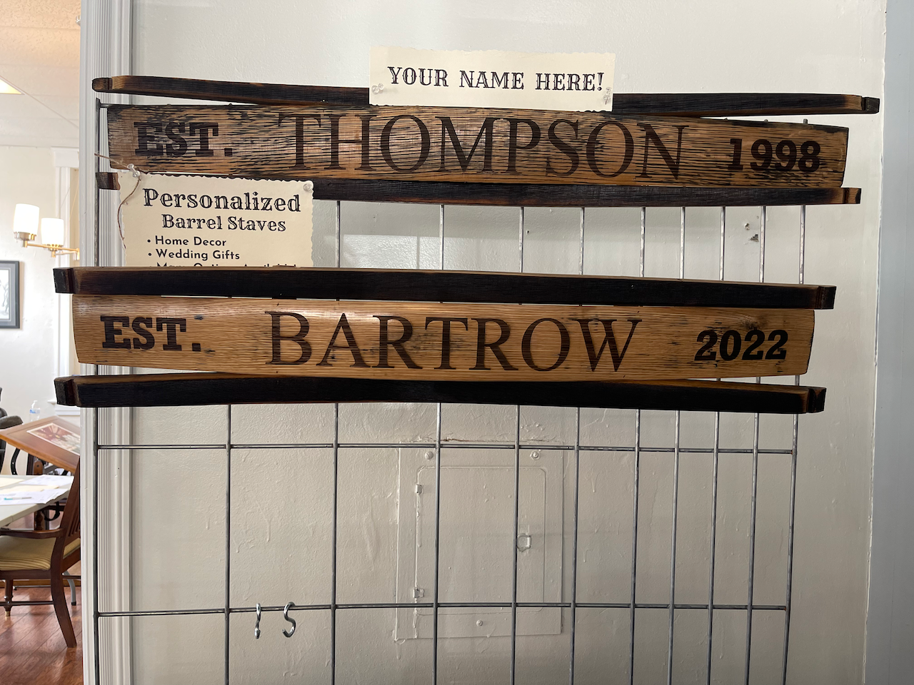 A wooden sign with the name thompson on it