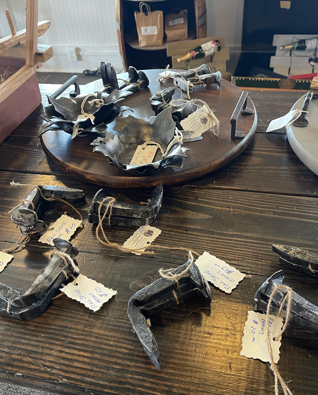 A wooden table with a bunch of metal objects on it.