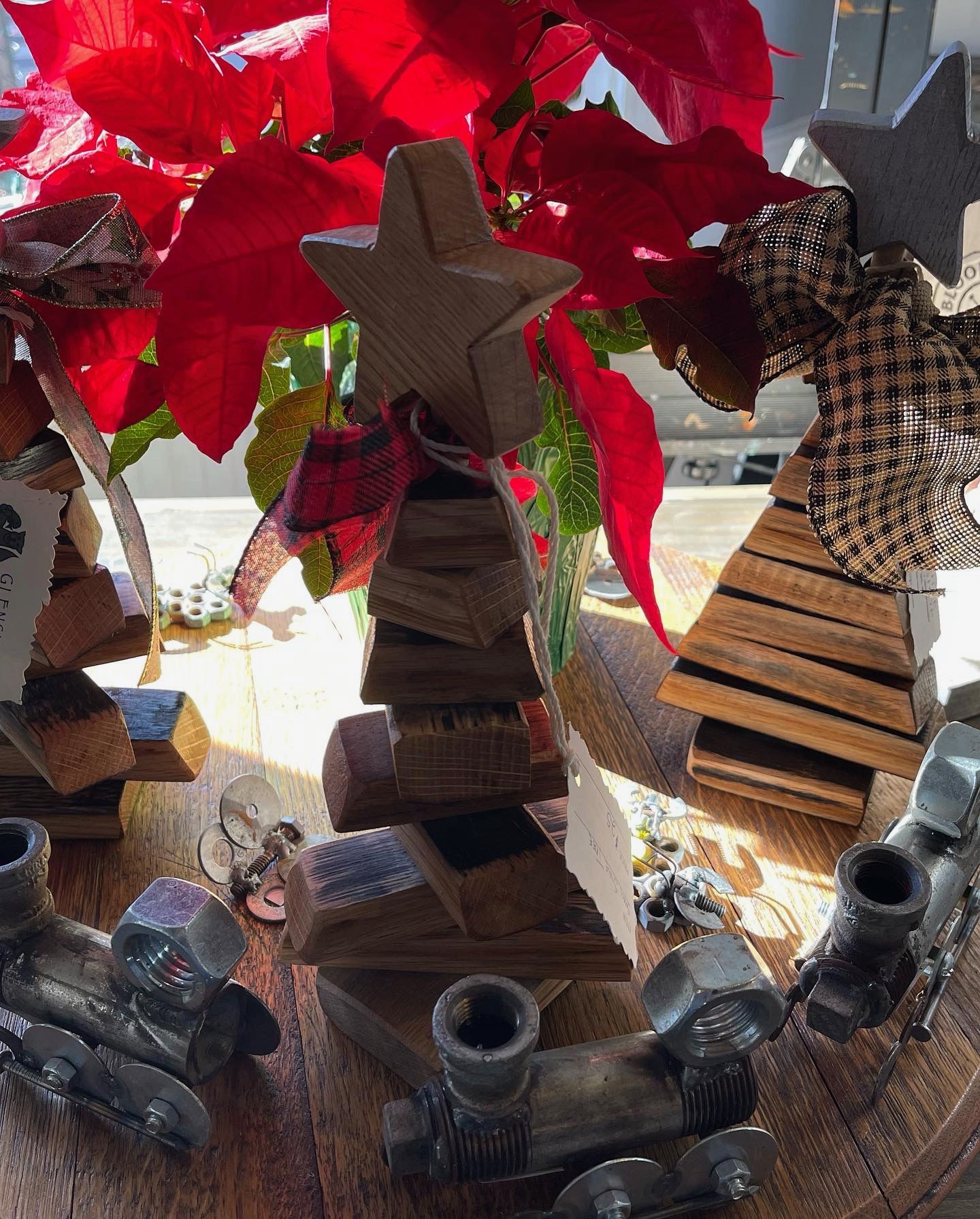 A wooden christmas tree with a star on top of it