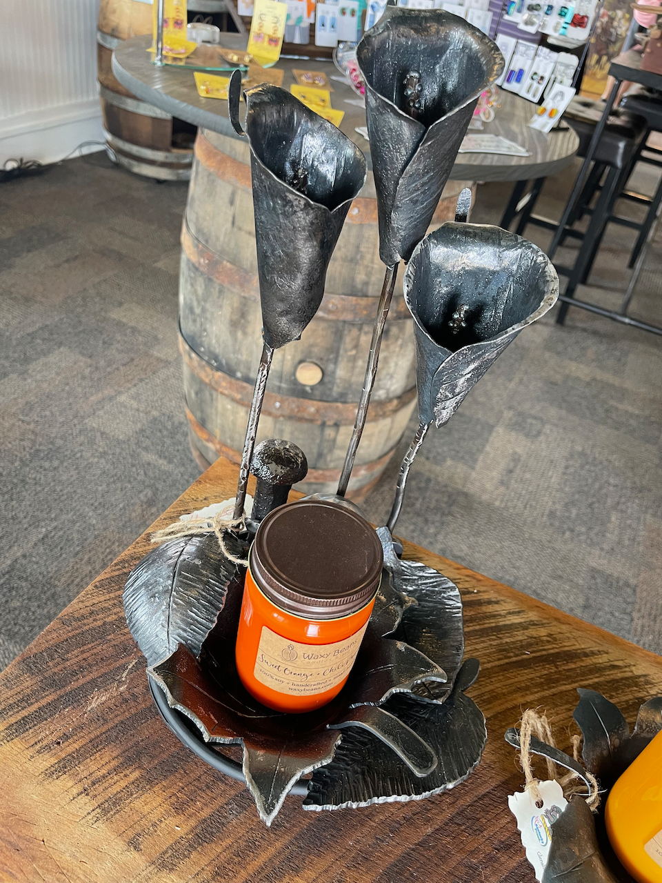 A candle is sitting in a candle holder on a table.