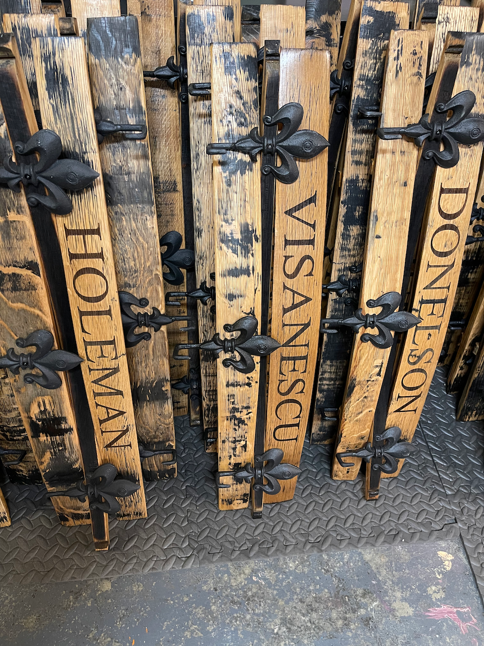 A bunch of wooden boards with the names of people on them