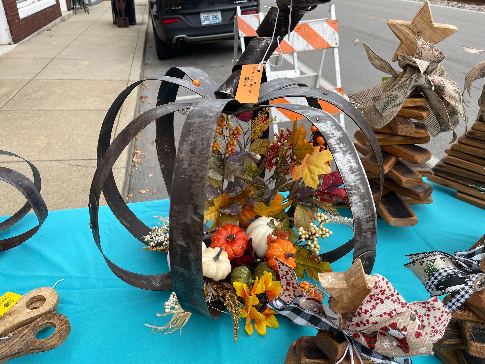 A pumpkin made out of a tire is sitting on a table.
