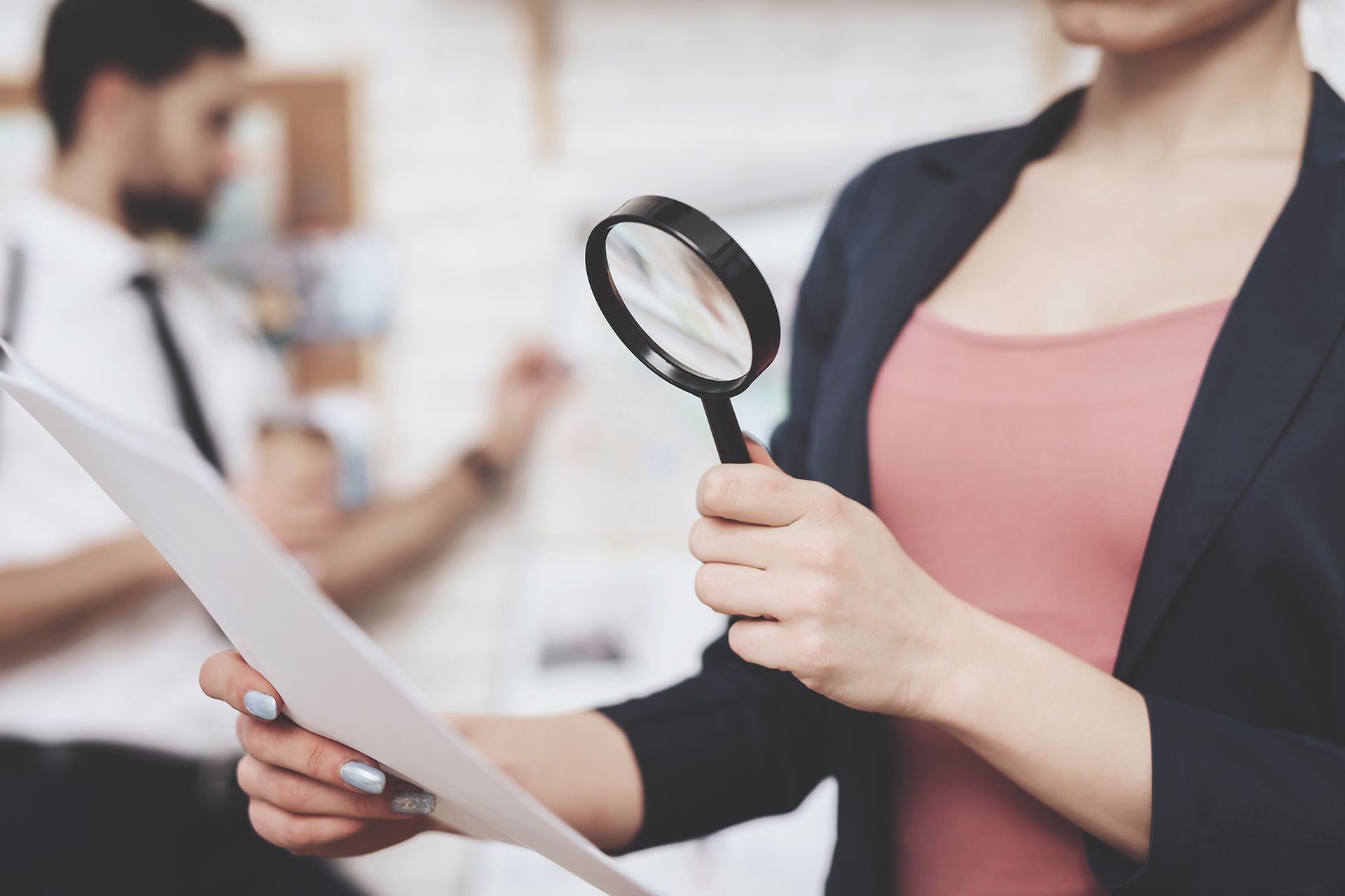 A Person Using A Magnifying Glass