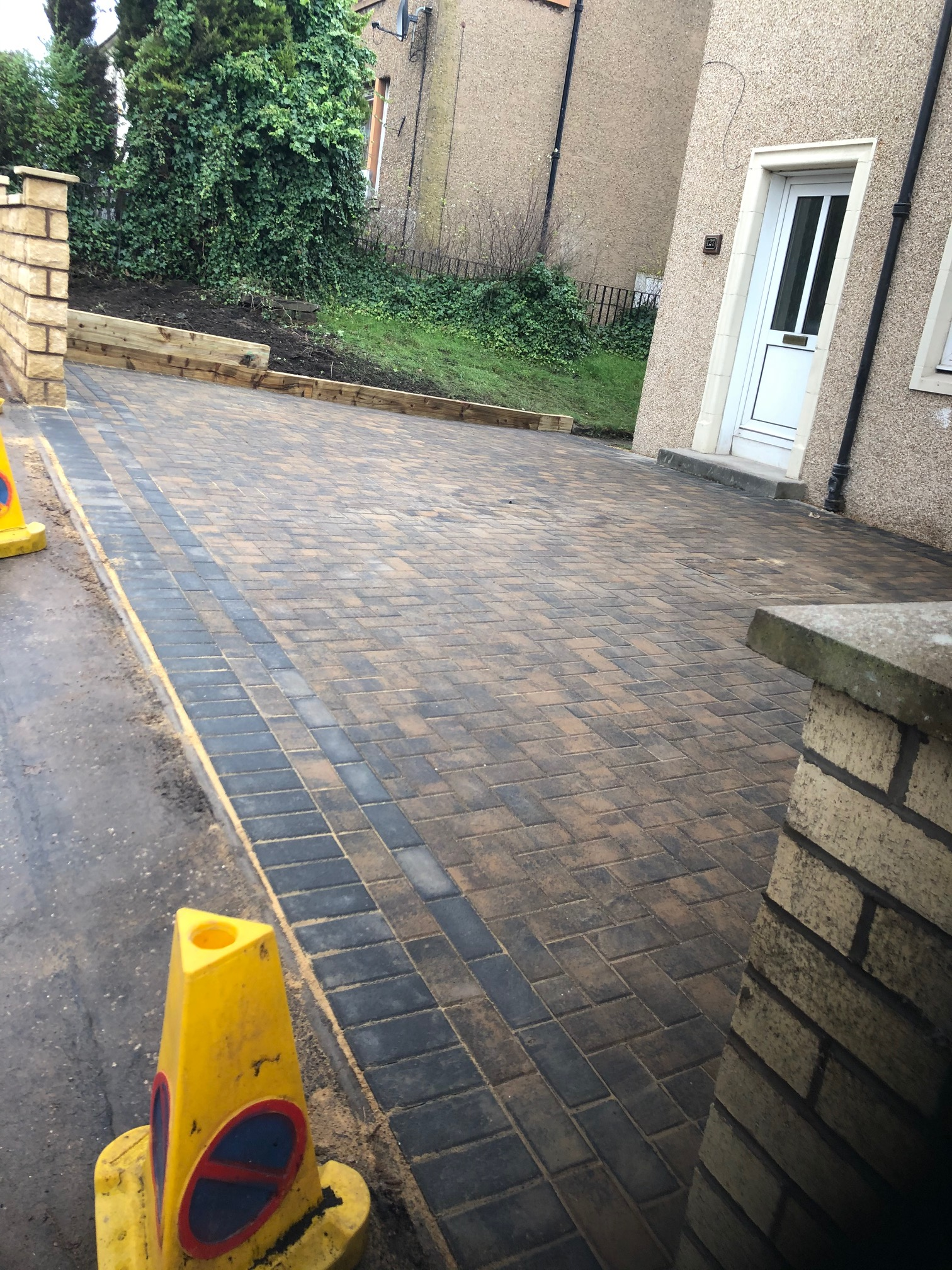 side pavement with yellow cone