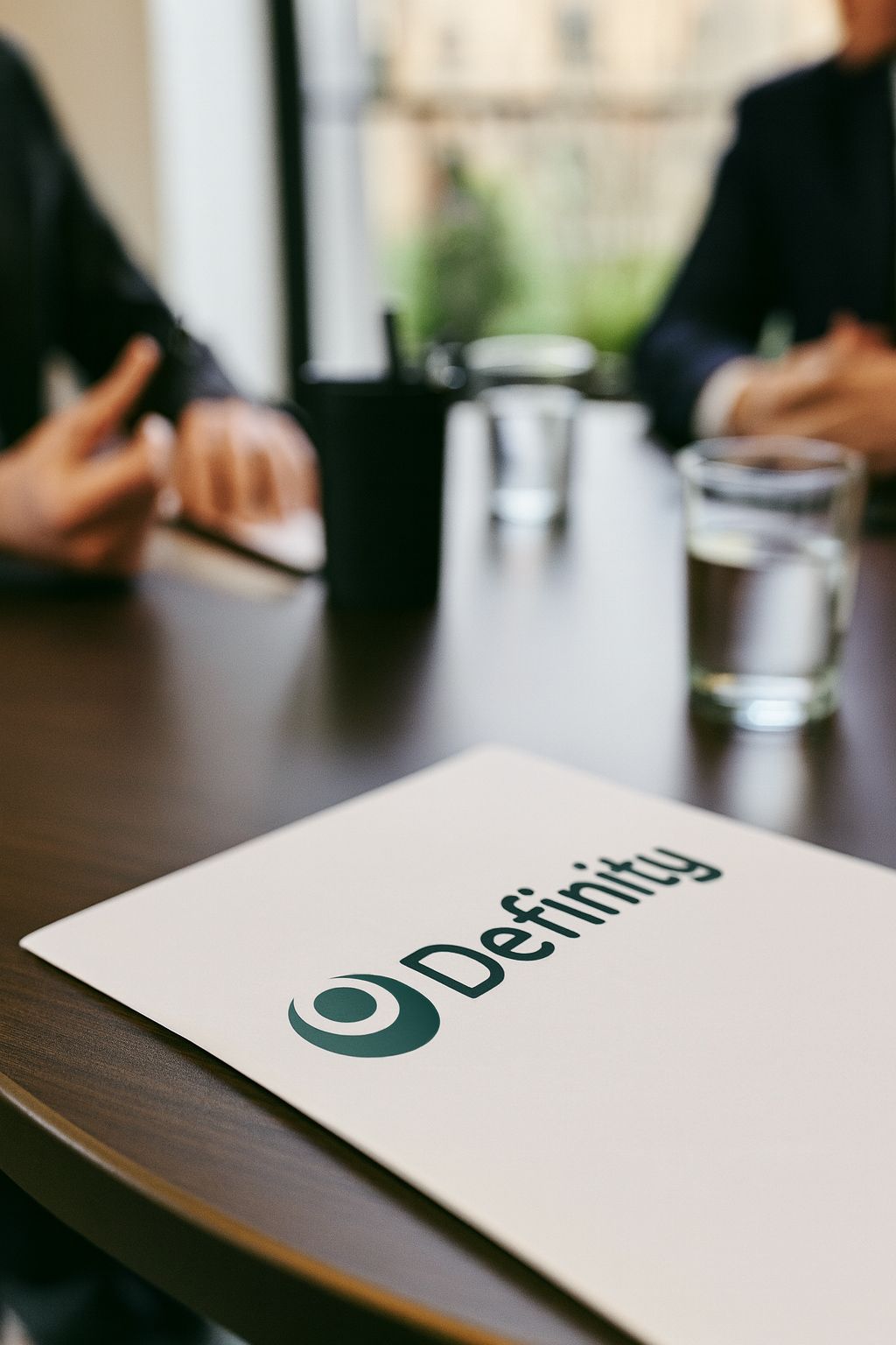 Definity Logo on leaflet sitting on a desk
