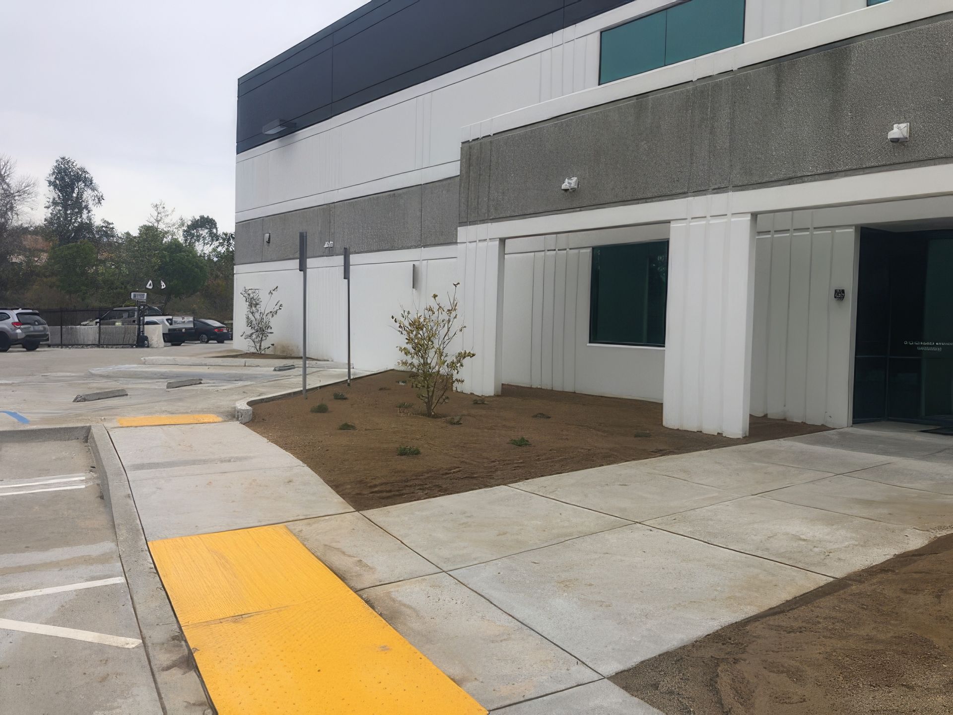 A large building with a yellow curb in front of it