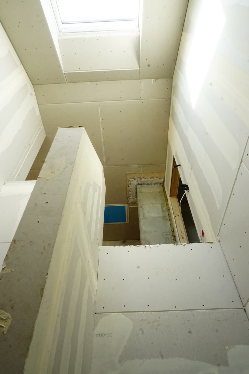 tricky sheetrock installation in a staircase area