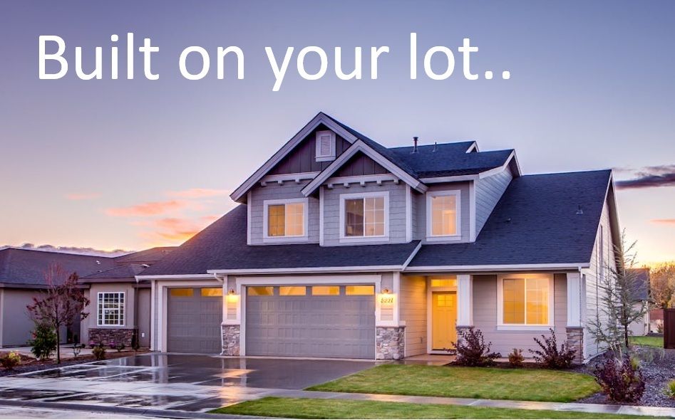 Wooden house frame against a blue sky with clouds. Sunlight illuminates the construction site.