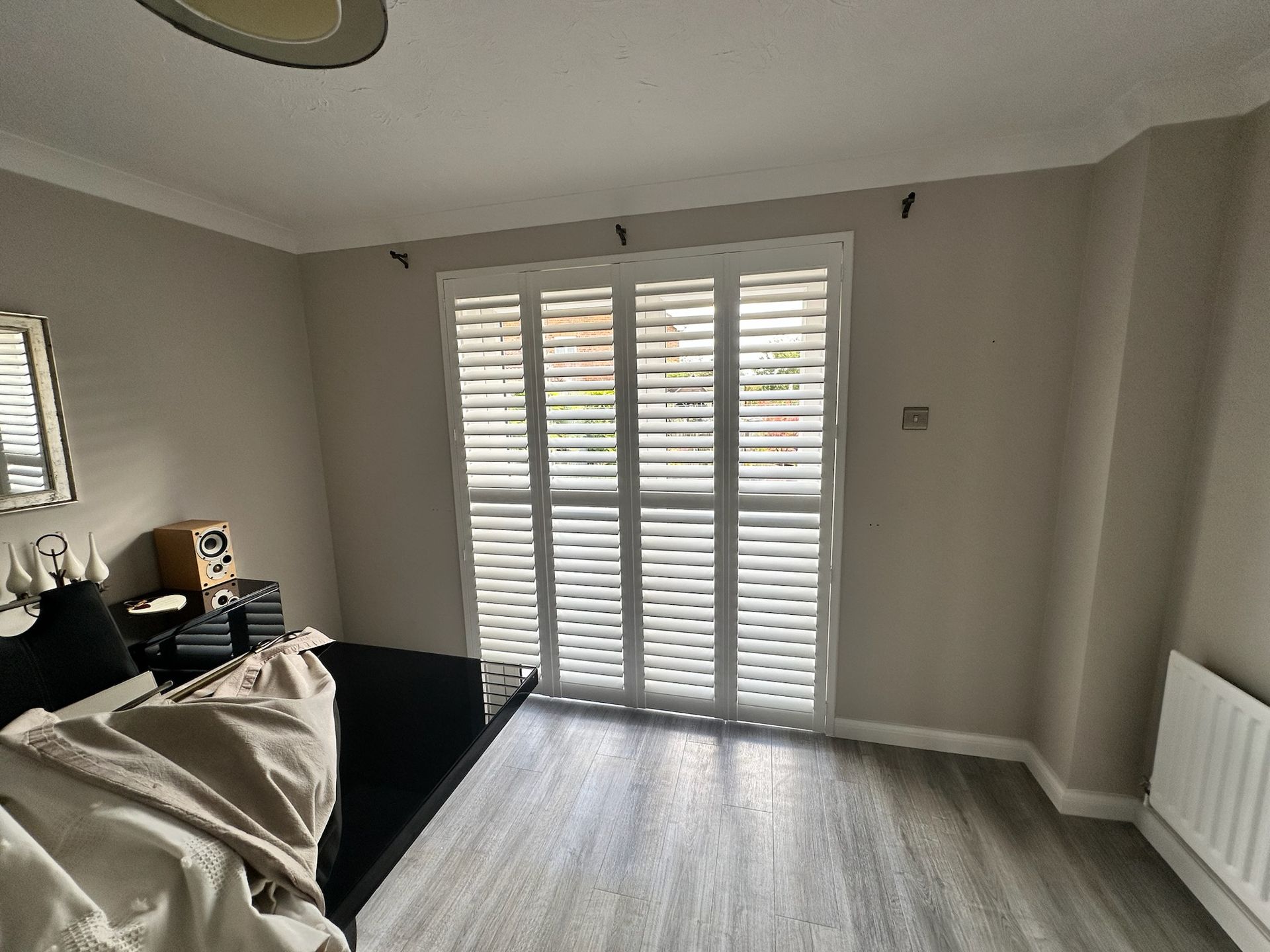 Elegant white patio door shutters enhancing natural light and privacy in a modern Reading home