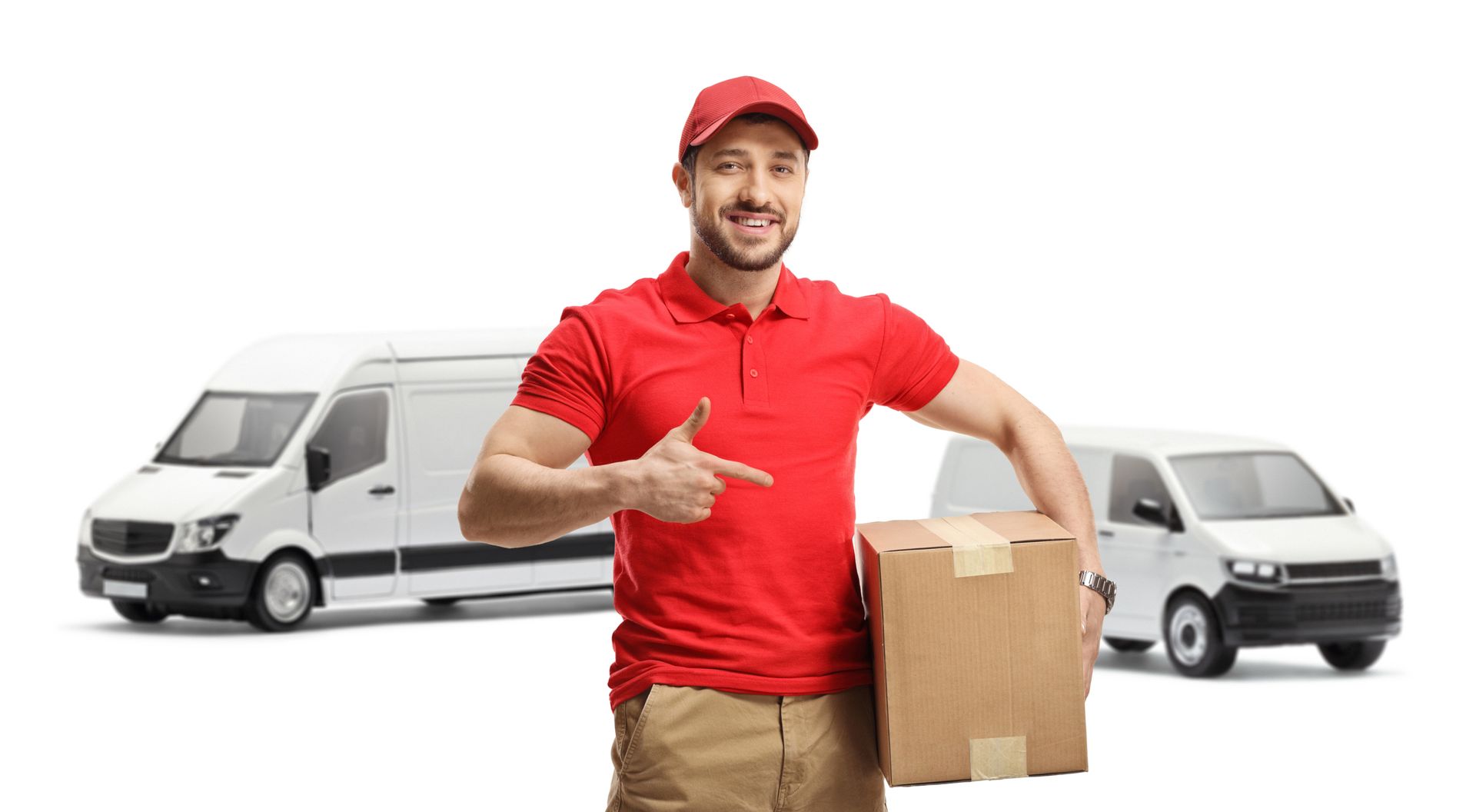Delivery person pointing at a package, smiling, with two white vans in the background.