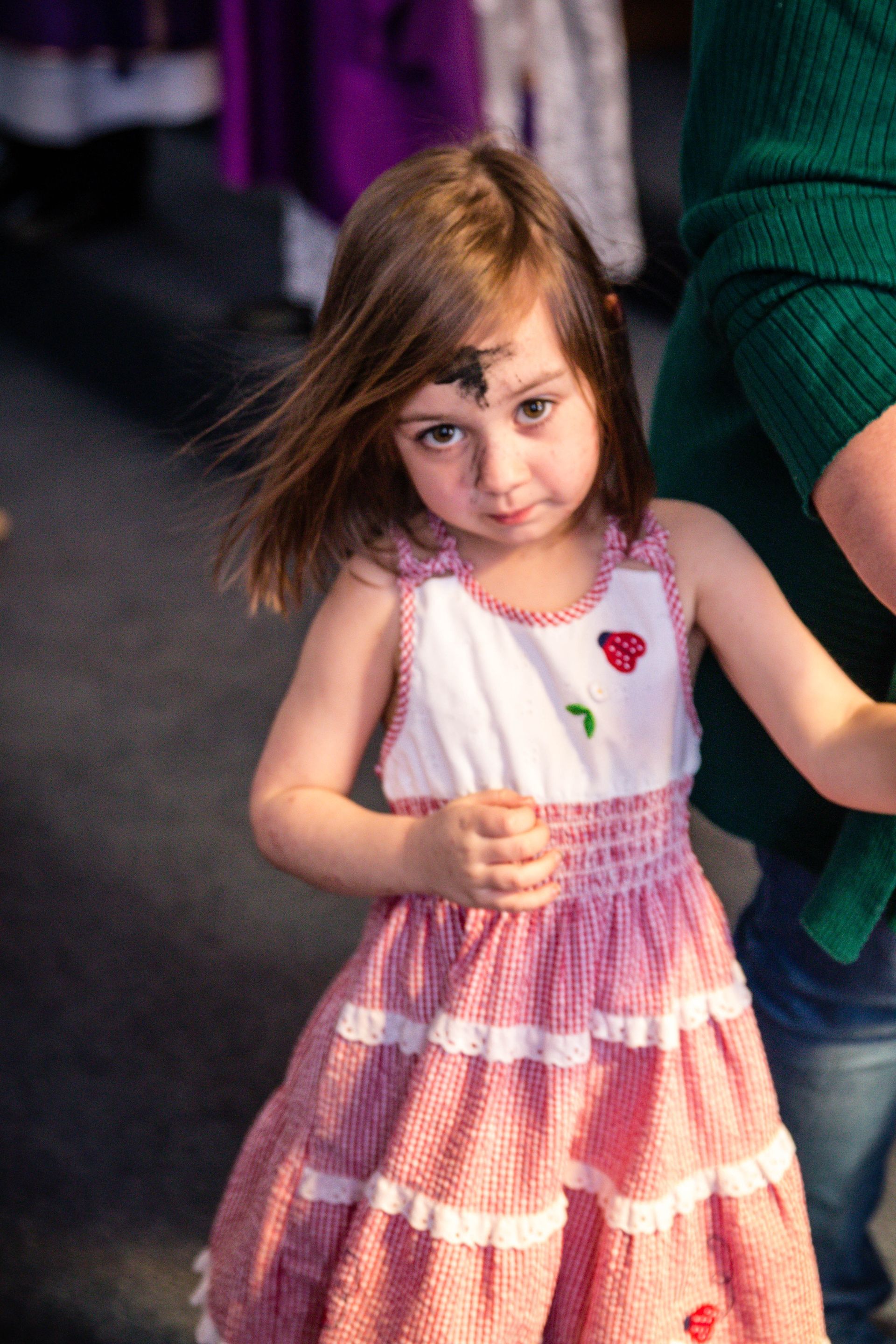 child receiving the ashes