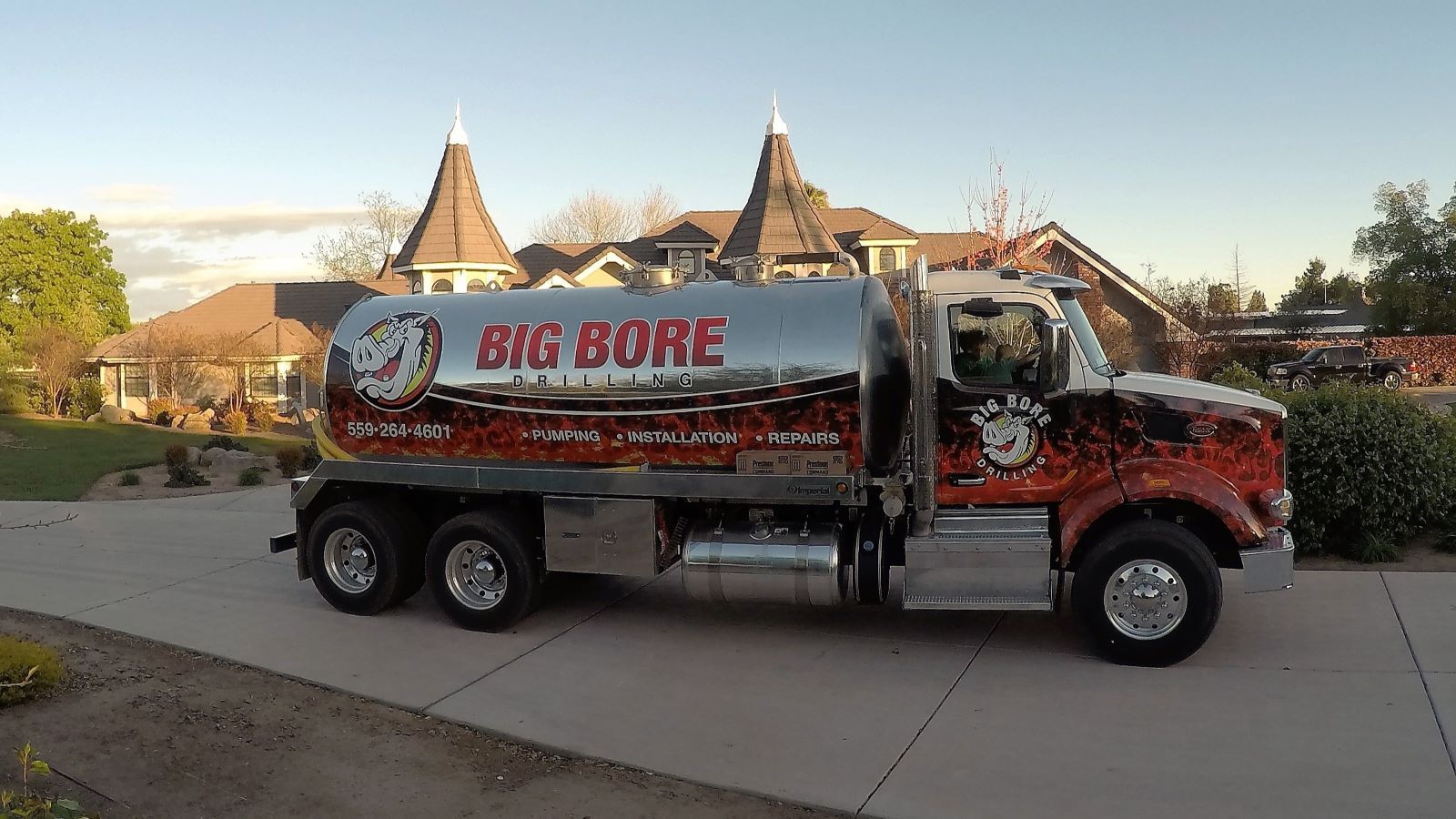 Big Bore Drilling septic pump truck at a residential property in the Fresno-Clovis area