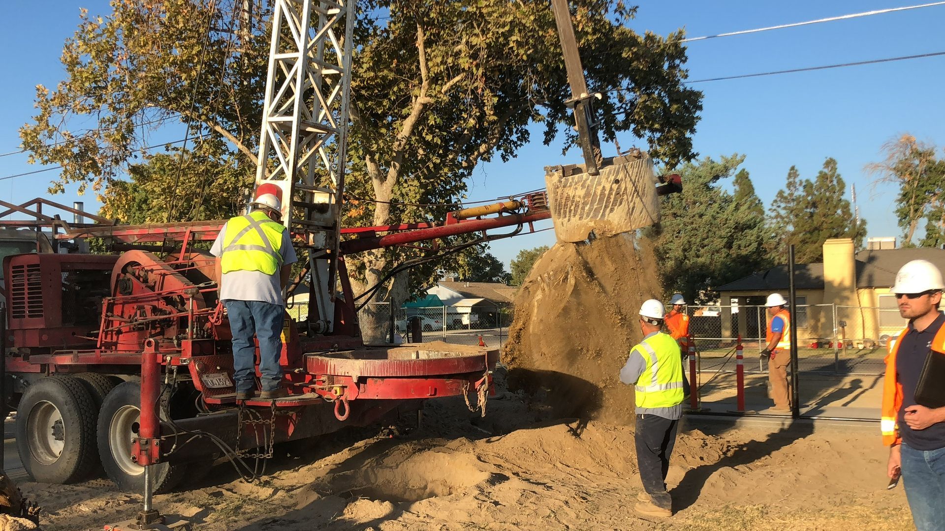 Drill rig boring cavity for stormwater area drain installation in Lemoore, California