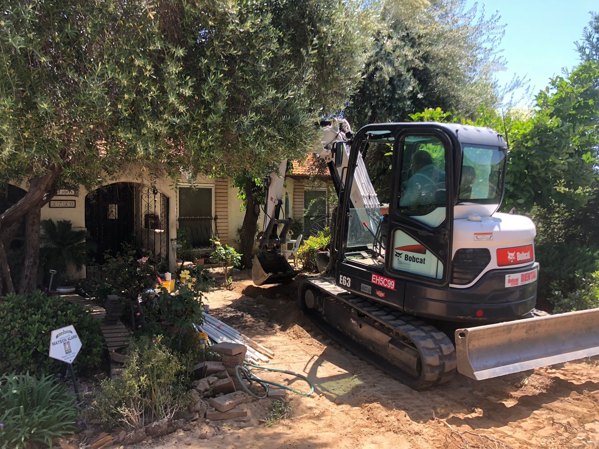 Big Bore Drilling Inc. (C42 License #579423) performing a septic repair in the tight-access Tarpey Village neighborhood of Fresno County.