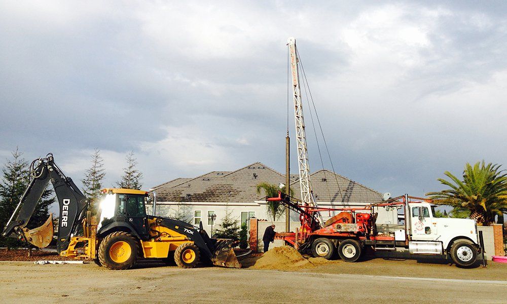 Construction Site with Heavy Duty Machinery — Fresno, CA — Big Bore Drilling Certified Septic & Hydroflushing