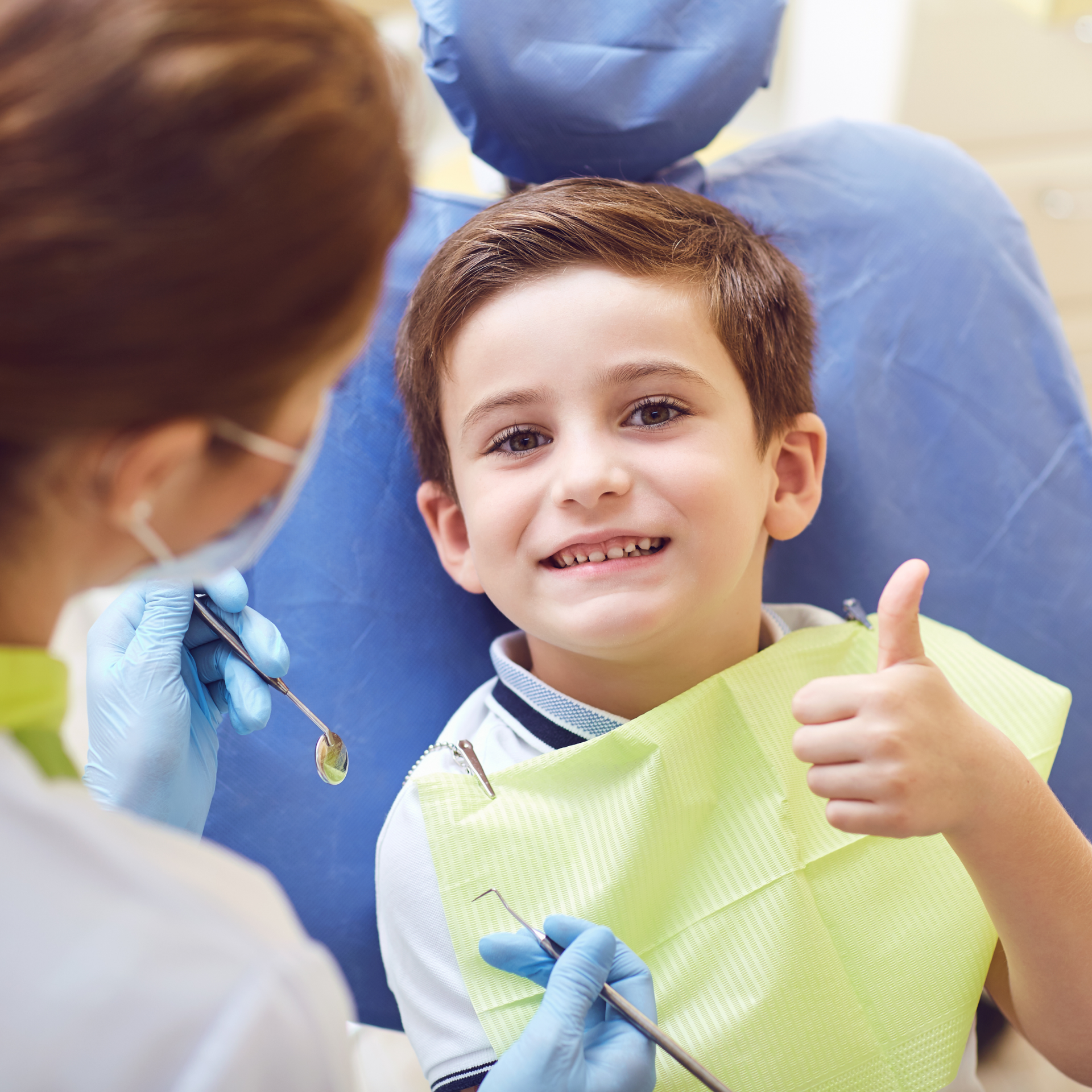 kid at dentist with thumb up | Best pediatric dentist in Mt. Pleasant SC