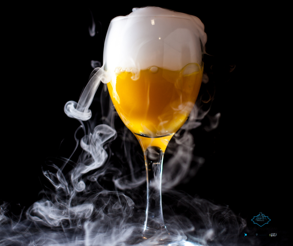 Cocktail glass with dry ice vapor for dramatic drink presentation in Detroit bars and restaurants.