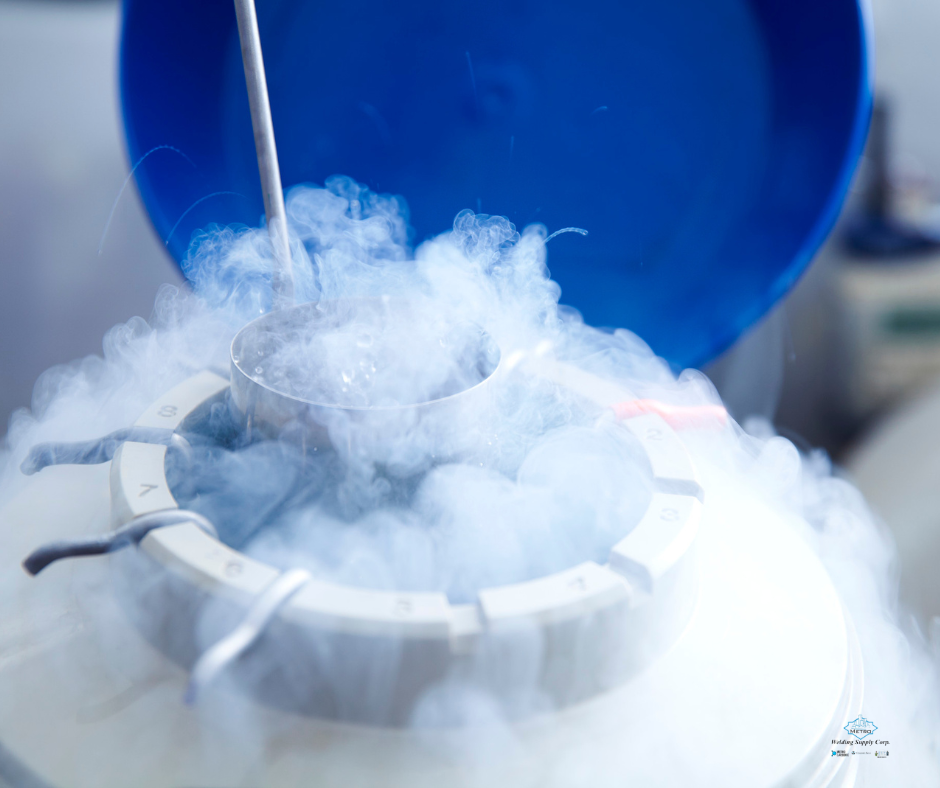 A technician adjusts valves on a frosted cryogenic gas tank, indicating extreme cold.