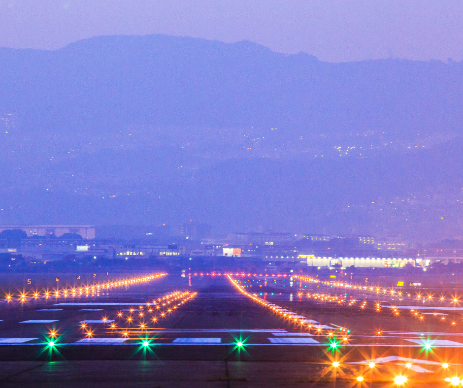 An illuminated airport runway at dusk, showcasing high-intensity lighting applications that utilize Krypton gas for enhanced visibility and efficiency.