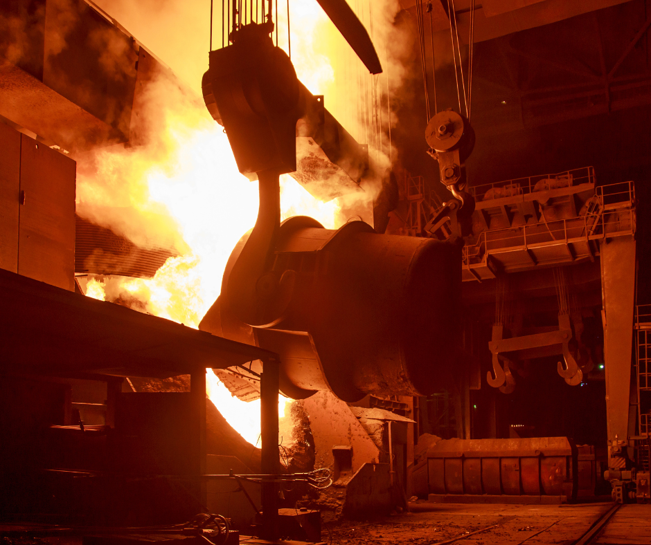 A molten metal being poured from a Basic Oxygen Furnace (BOF) in a steel mill.